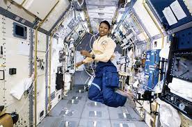 Photo of Mae C. Jemison floating weightless in space