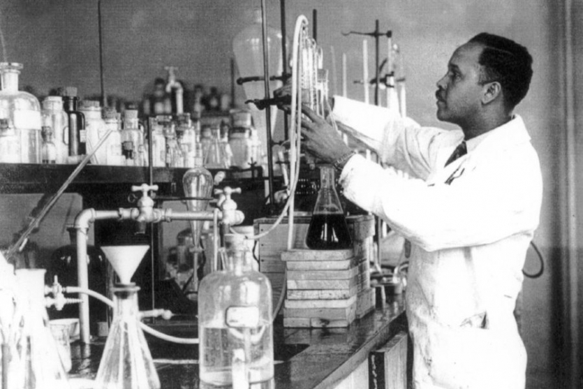 Image of Dr. Percy Julian in his laboratory with glassware